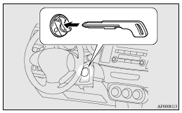 Mitsubishi Lancer: To turn from “ACC” to “LOCK”. 8. Insert the keyless operation key into the emergency key.