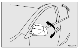 Mitsubishi Lancer: Retracting and extending the outside mirrors. [For vehicles equipped with the mirror retractor switch]
