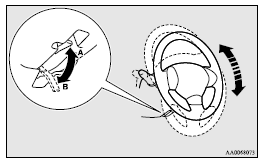 Mitsubishi Lancer: Steering wheel height adjustment. A- Locked