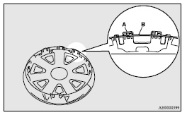 Mitsubishi Lancer: Wheel covers. 2. Align the air valve (C) of the tyre with the notch (D) in the wheel cover.